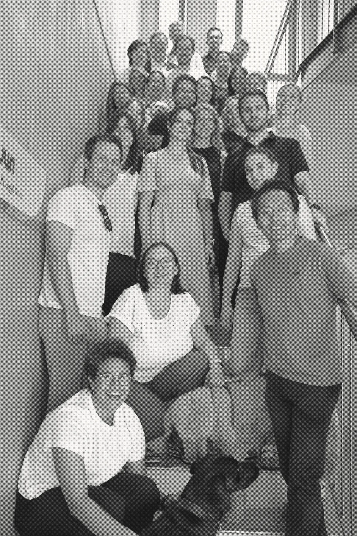 The JUN team on the staircase of the firm's building